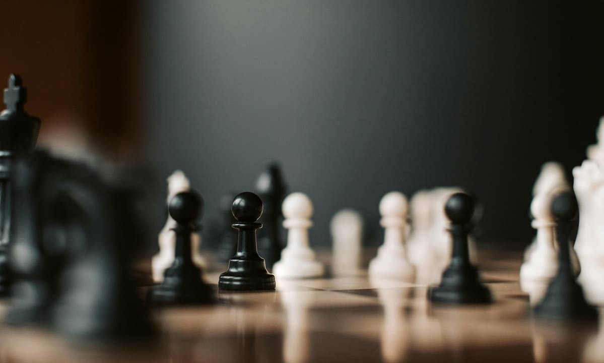 Images of chess pieces symbolizing geopolitical conflict